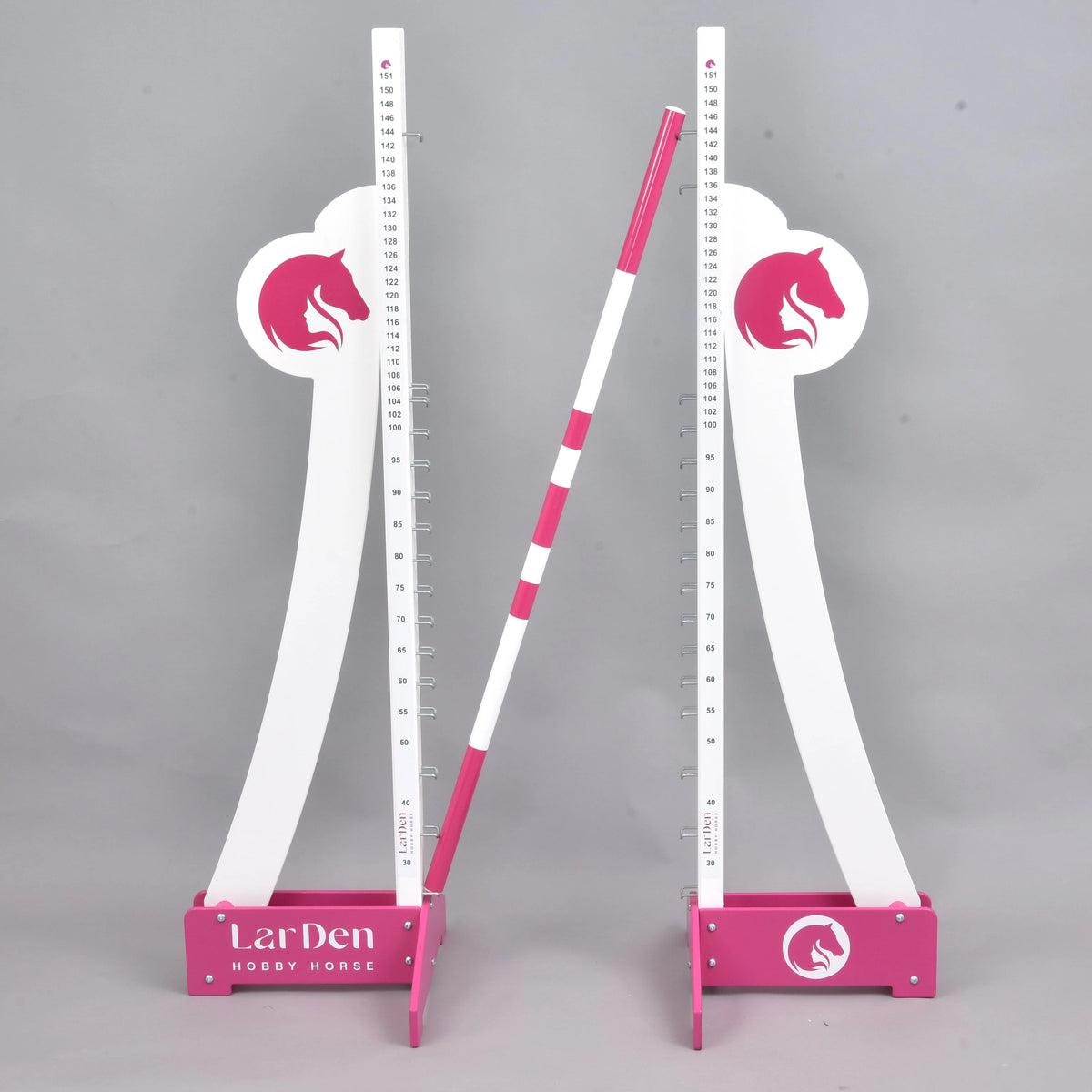 Both puissance stands side by side with the pink and white pole leaning diagonally between them