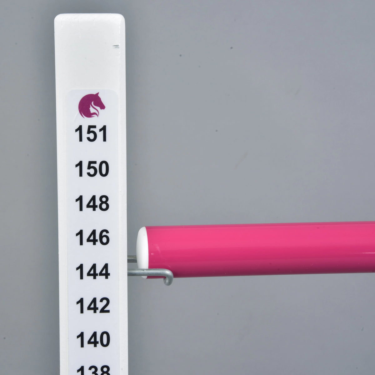 Top of the scale with a pink horse logo above 151 cm and the pink pole resting on the hook at 144