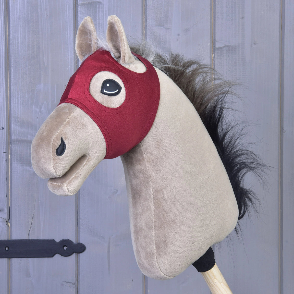 Horse Mask without Ears Velvet by LarDen in burgundy on a beige Hobby Horse with a dark mane, eyes and ears left free