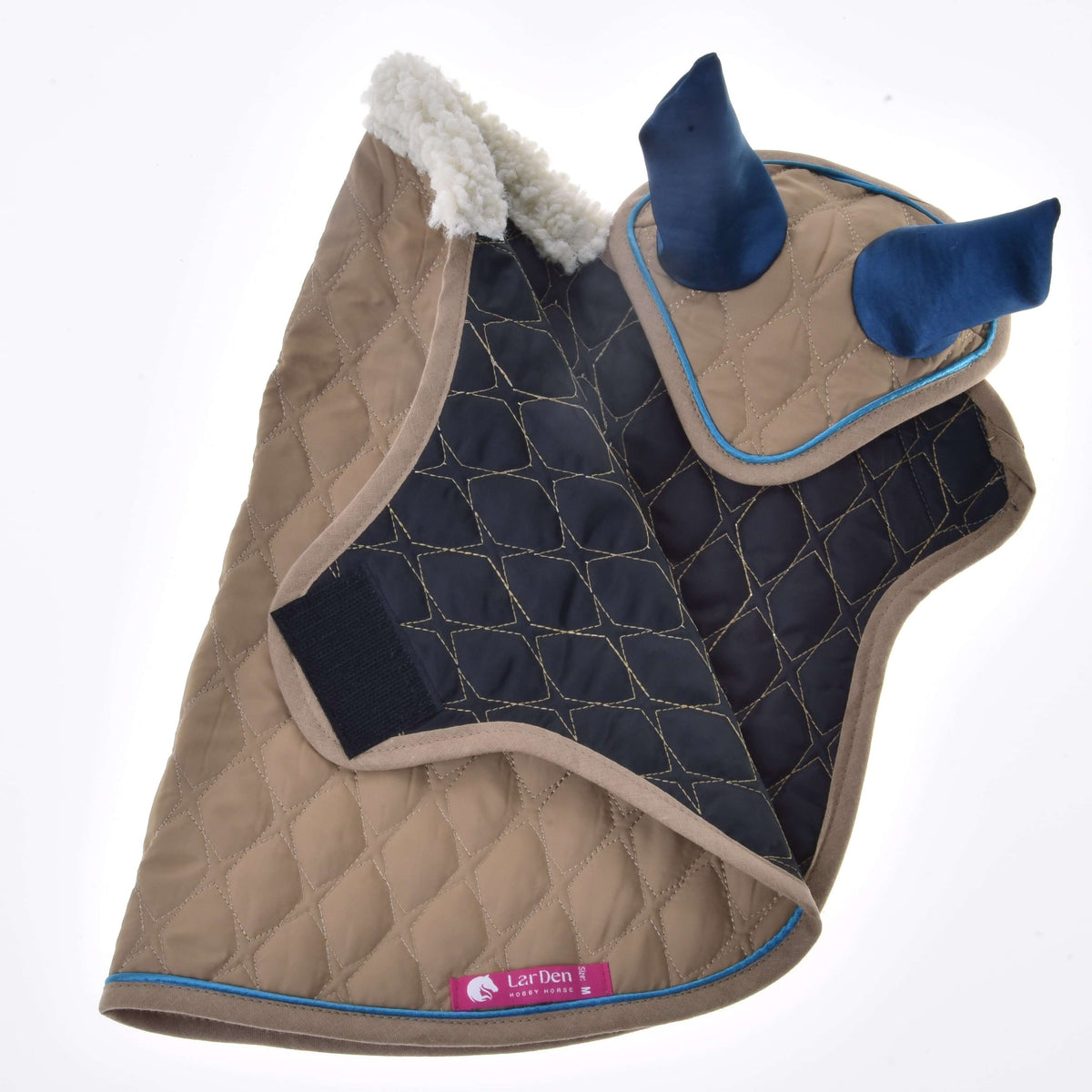 Beige blanket and ear bonnet turned over to show the navy quilted lining, chest fastener and pink LarDen label