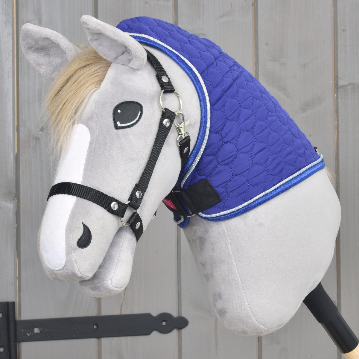 Grey Hobby Horse wearing only the removable Bluebell neck cover, royal blue quilting with silver and blue piping