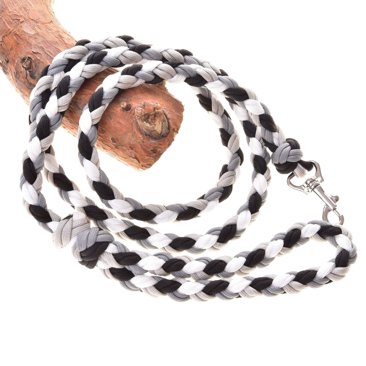 LarDen Hobby Horse Braided Lead Rope Black/White, a paracord lead with grey accents and silver clip draped over a branch