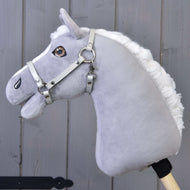 LarDen Halter - light grey leatherette on a grey plush Hobby Horse with a fluffy white mane, grey wooden wall