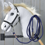 Grey Hobby Horse in a black halter with the navy Lunging Rope clipped on and coiled loosely over its neck