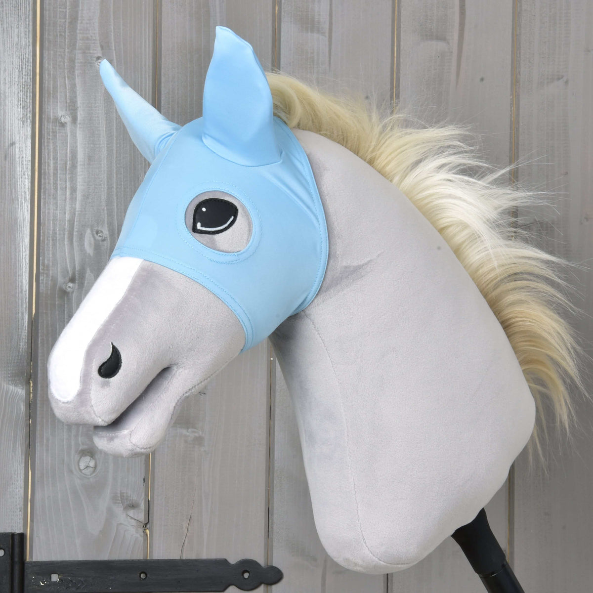 Horse Mask Sky by LarDen, a light blue stretch mask with ears and eye openings on a light grey Hobby Horse with a cream mane