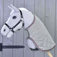 Light grey Hobby Horse in a black halter wearing the silver grey quilted blanket with grey and raspberry trim
