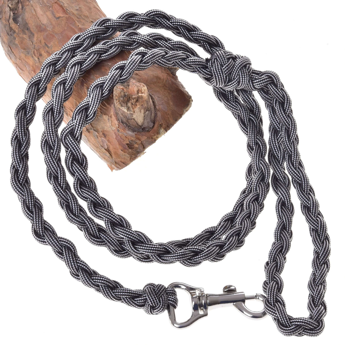 LarDen Hobby Horse Knitted Lead Rope Graphite, a braided grey paracord lead with silver snap hook, coiled over a wooden branch