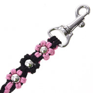 Knotted pink and black flowers with silver beads beside the swivel snap hook of the Hobby Horse Lead Rope Bloom Pink