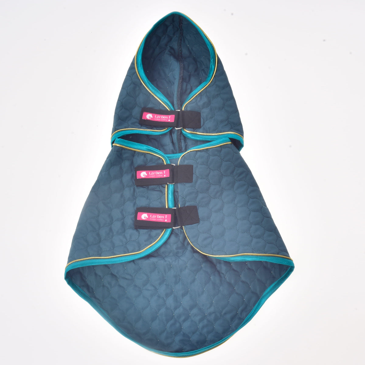 Lagoon blanket with its neck cover laid out flat from above, dark teal quilting edged in turquoise and gold