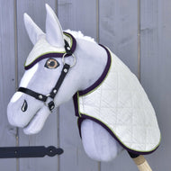 Grey Hobby Horse with amber eyes and black halter wearing Set Leonardo, ivory quilting trimmed in purple and green