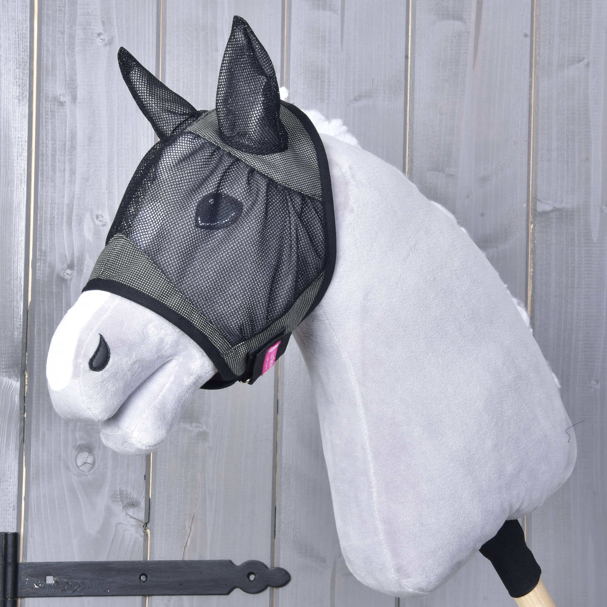 Hobby Horse Fly Mask De Luxe Grey by LarDen with black mesh ears and eye net on a light grey plush head