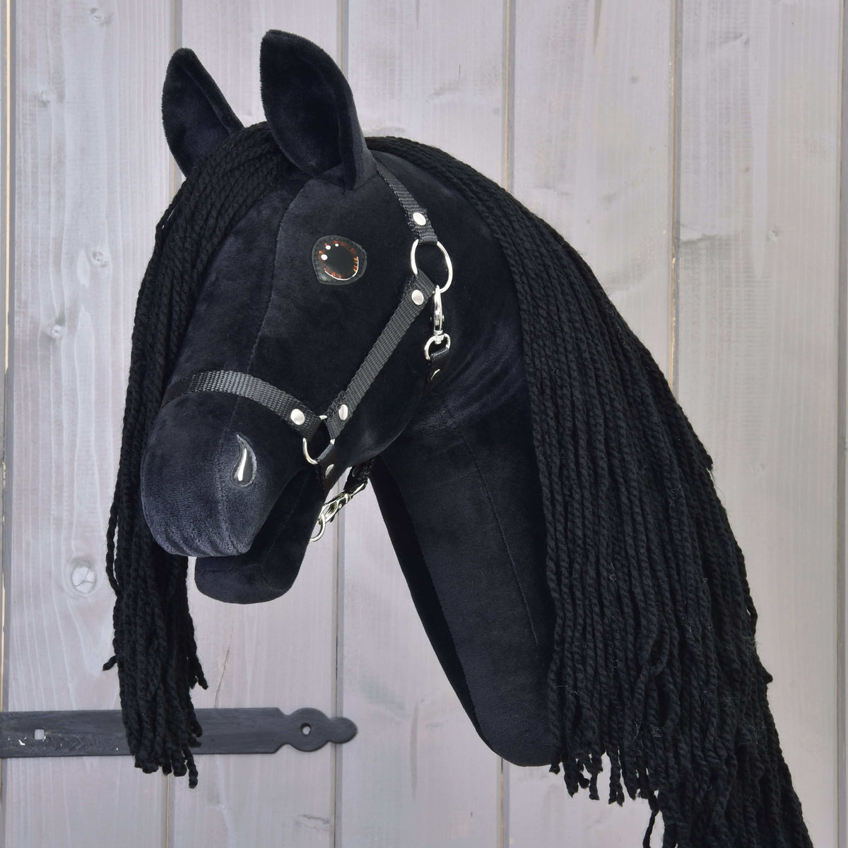 Hobby Horse Maximus with Black Halter by LarDen, a black plush head with a long black yarn mane and shiny brown eyes
