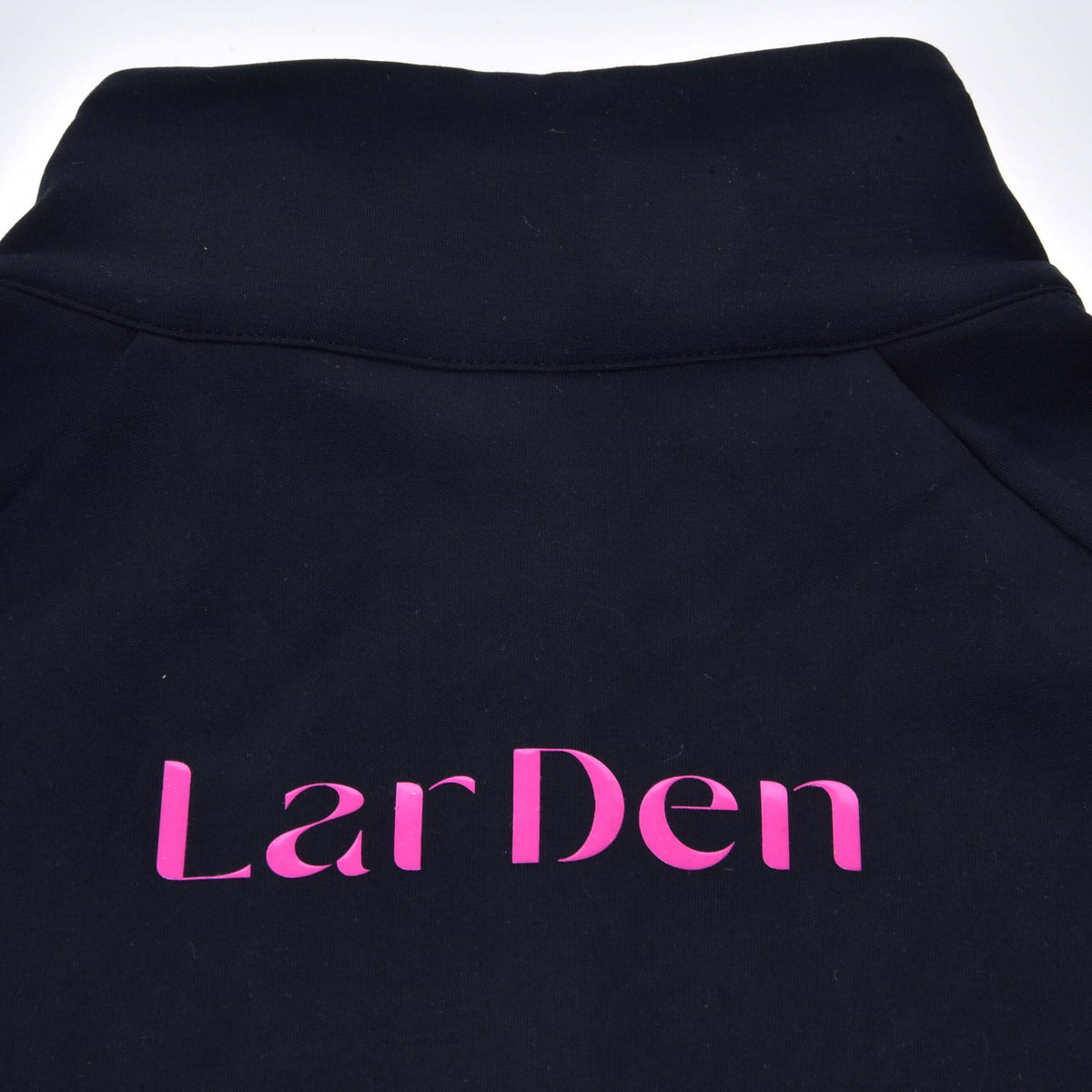 Close-up of the back of the Hobby Horse LarDen Sweatshirt: big pink lettering below the black stand-up collar