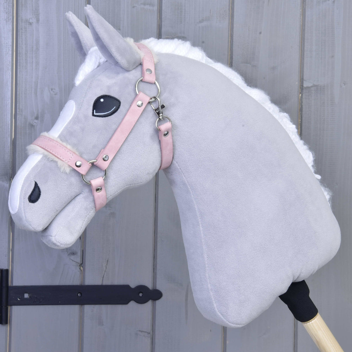 Light grey Hobby Horse with white mane wearing the dusty pink leatherette halter with cream fur trim