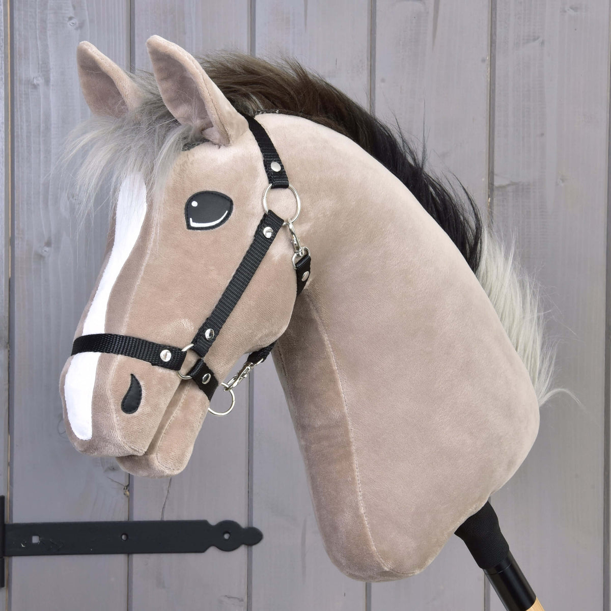 Hobby Horse Piccolino with Black Halter by LarDen, a greyish beige plush head with a white blaze and a black and silver mane