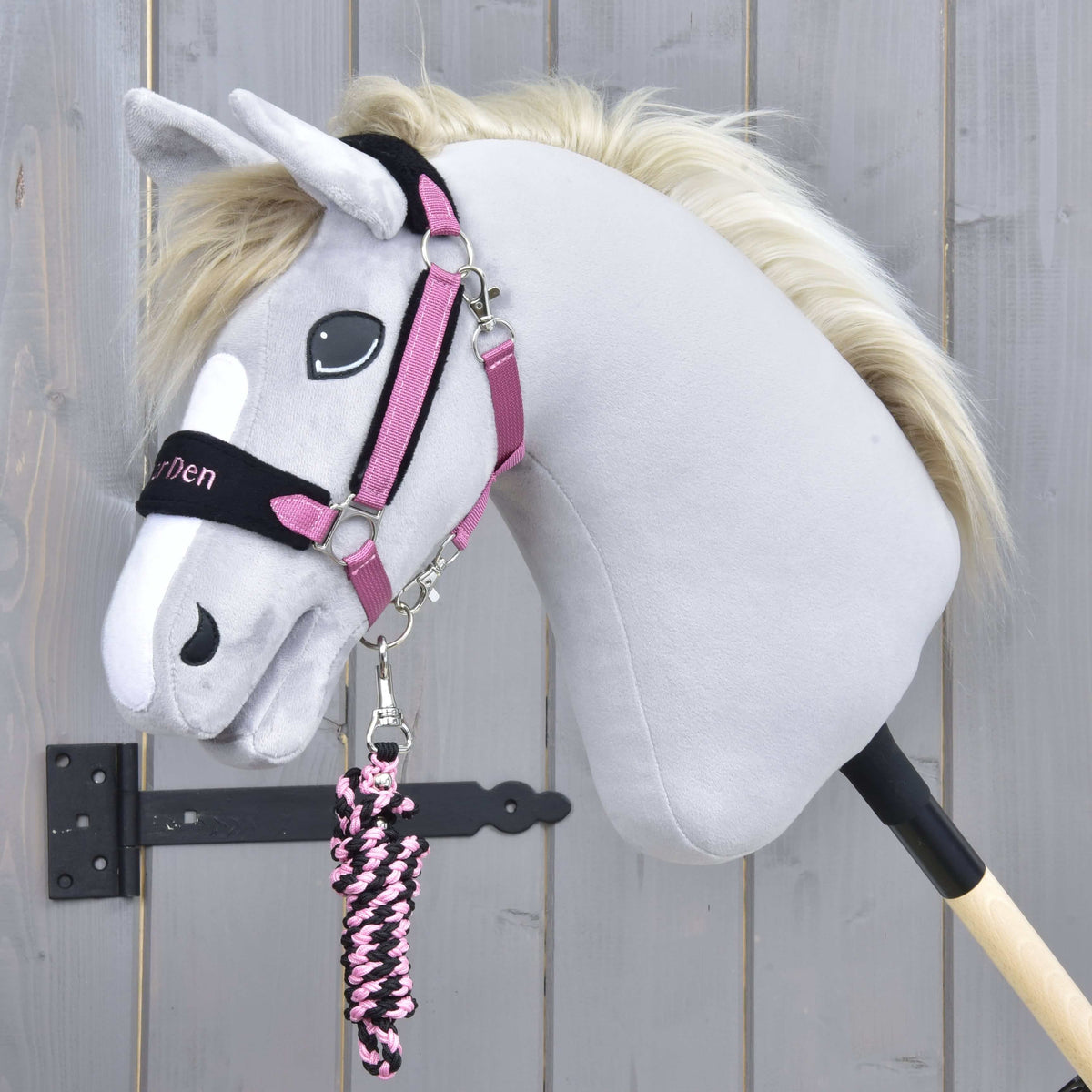 Exclusive Pink halter on a grey Hobby Horse with a cream mane, the pink and black braided lead rope coiled below the chin