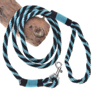 LarDen Hobby Horse Lead rope stripe green, a black and green twisted rope lead with silver snap hook on a branch