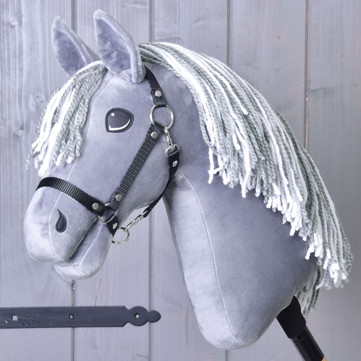 Hobby Horse Calypso with Black Halter by LarDen, a grey plush head with a mane of mixed grey and white yarn