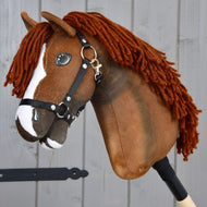 Hobby Horse Cooper with Black Halter by LarDen, a chestnut brown plush head with a white blaze and copper yarn mane