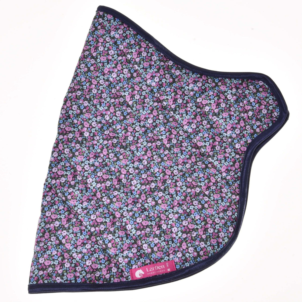 Full view of the quilted flower blanket with its curved neck opening and a pink label on the navy-bound lower edge