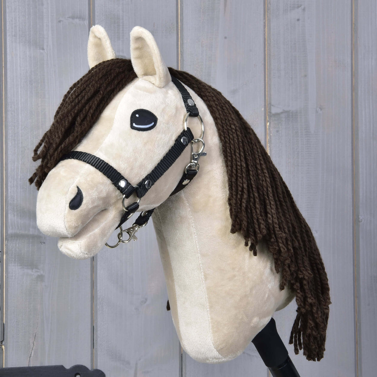 Hobby Horse Frederik LD with black halter by LarDen, a cream plush head with a long dark brown yarn mane and forelock