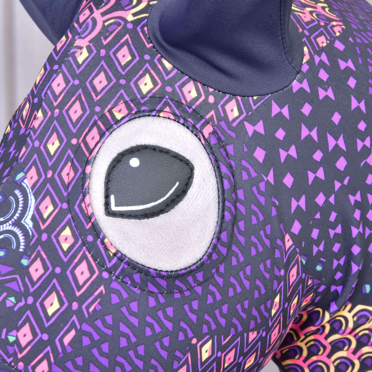 Close-up of the eye opening in the purple and black Mandala suit with pink, yellow and violet diamond motifs on a Hobby Horse