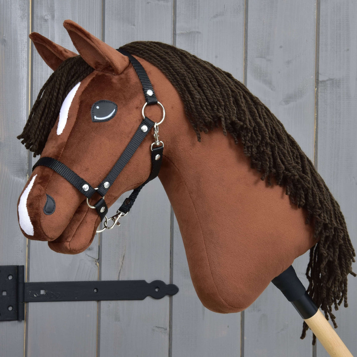 Hobby Horse Rocky with Black Halter by LarDen, a chestnut plush head with a dark brown yarn mane and white markings