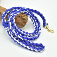 Hobby Horse braided lead rope white/blue by LarDen, plaited royal blue and white cord with a gold snap hook, over a log