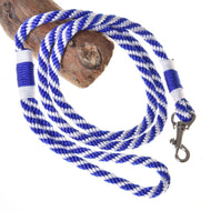LarDen Hobby Horse Lead Rope Stripe Blue, a blue and white braided lead with a silver snap hook draped over driftwood